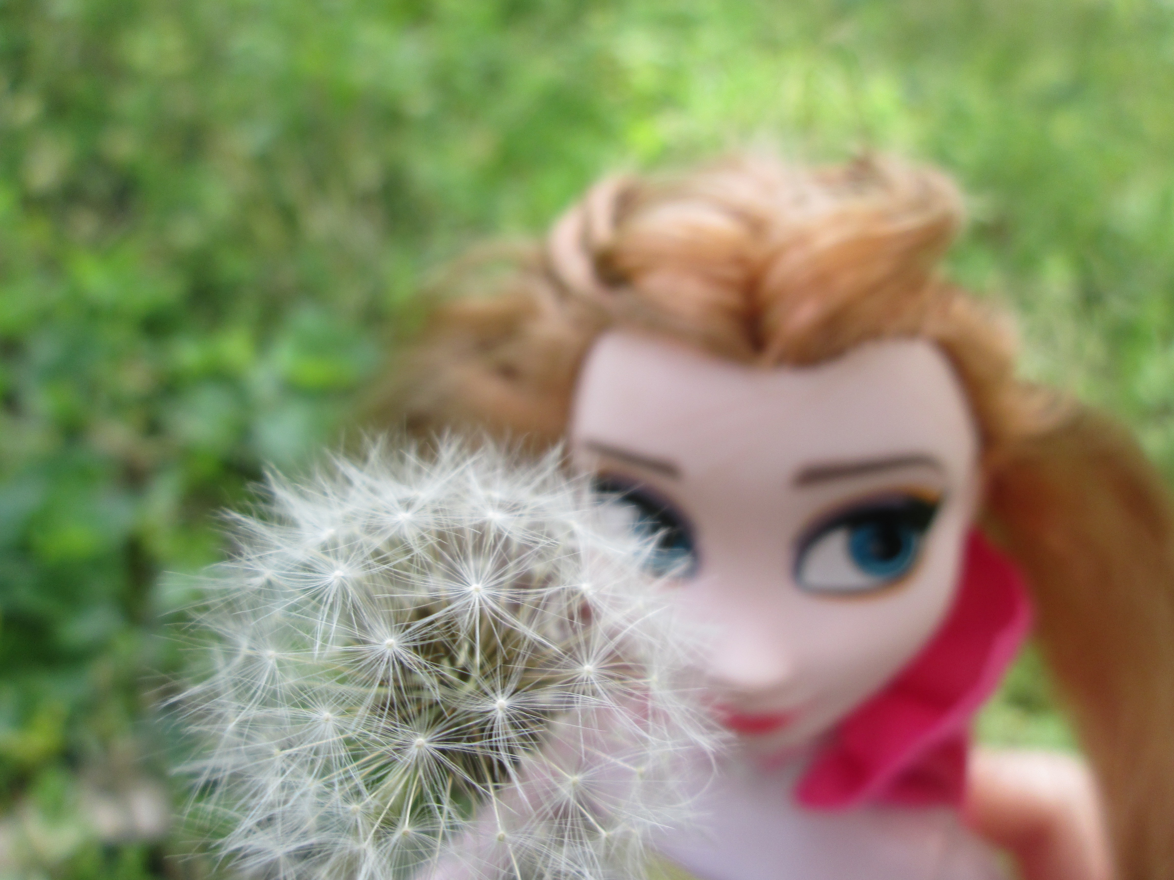 doll holding flower